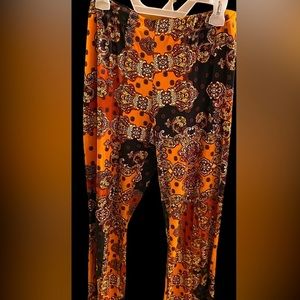 Bell bottom pants with a touch of a darker brown&orange color to them.